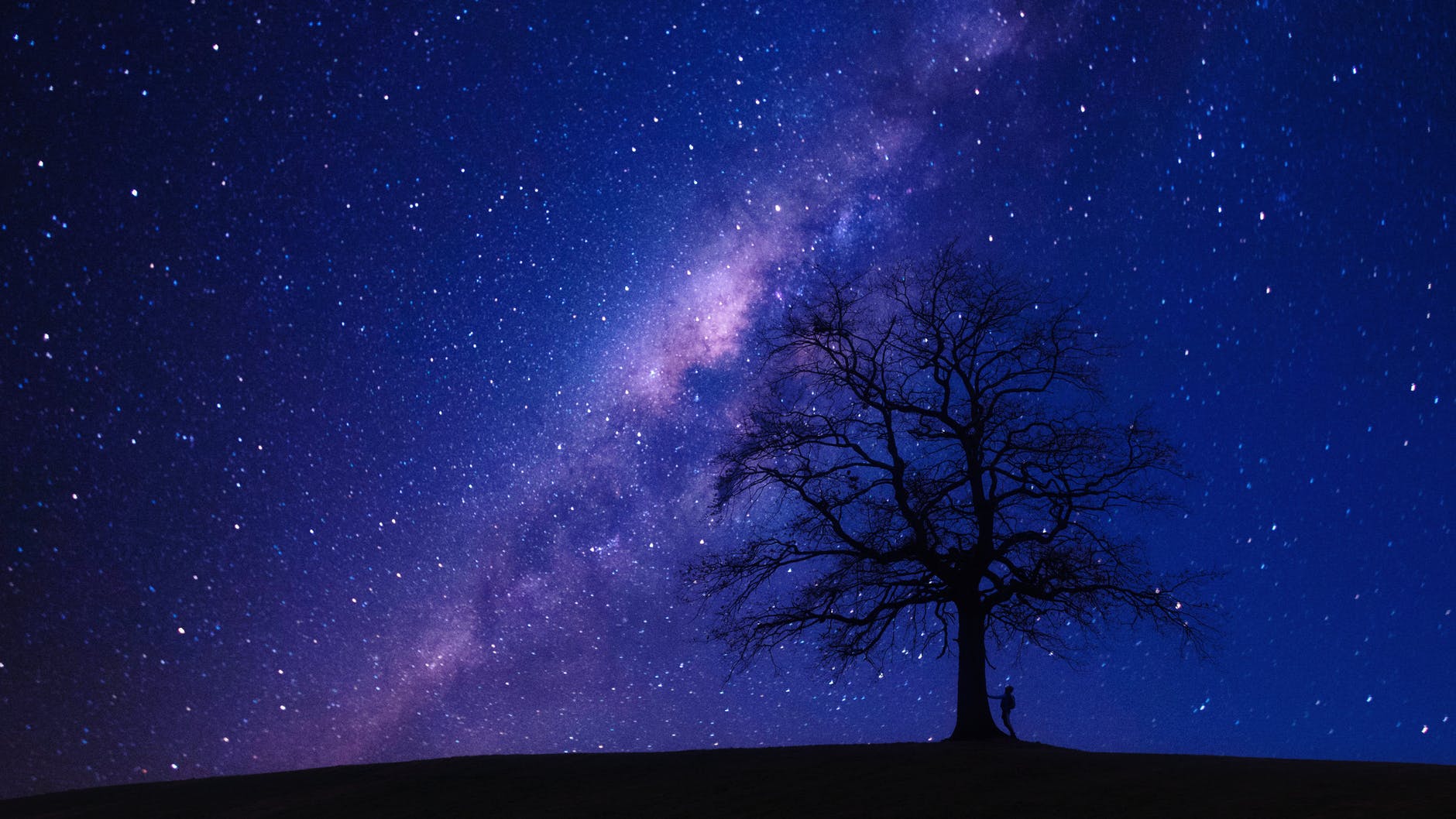 Infant stars at the edge of the Milky Way are from neighboring galaxies