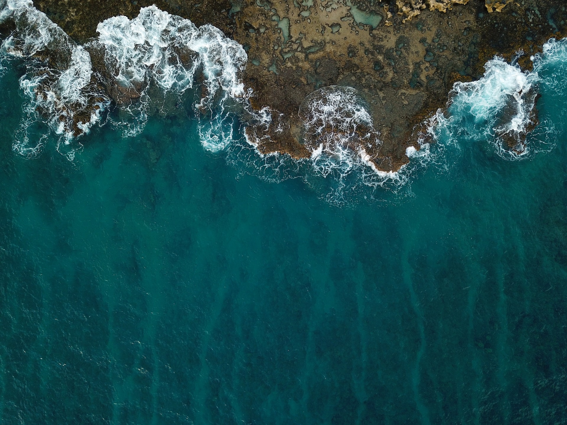 The Big Picture: Waves breaking along a Hawaiian seascape.